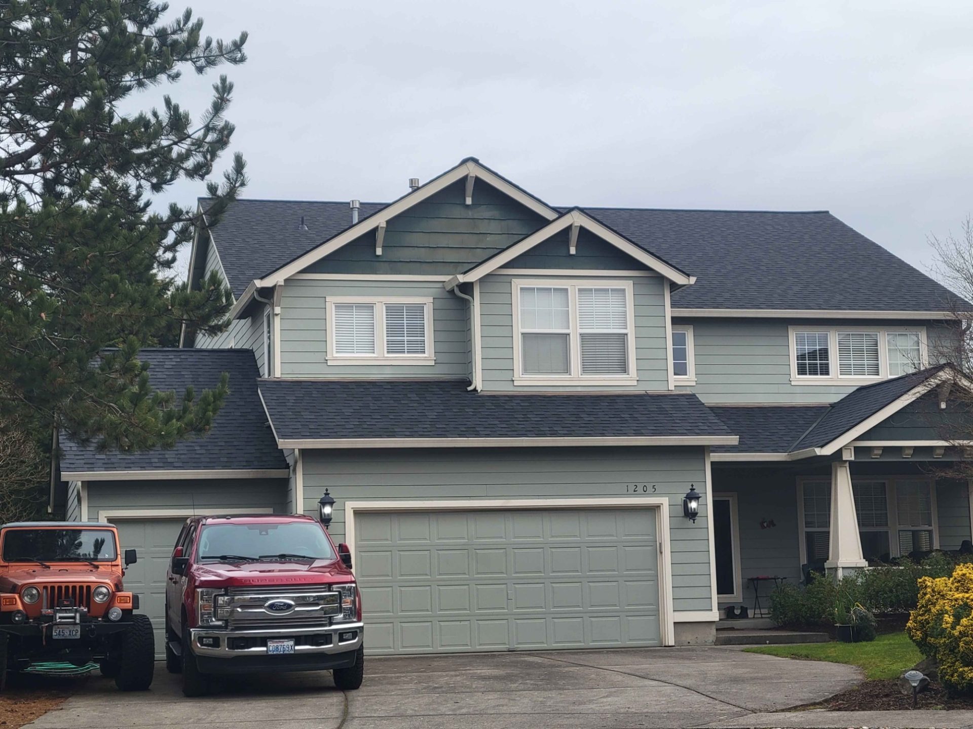 Residential home with parked vehicles